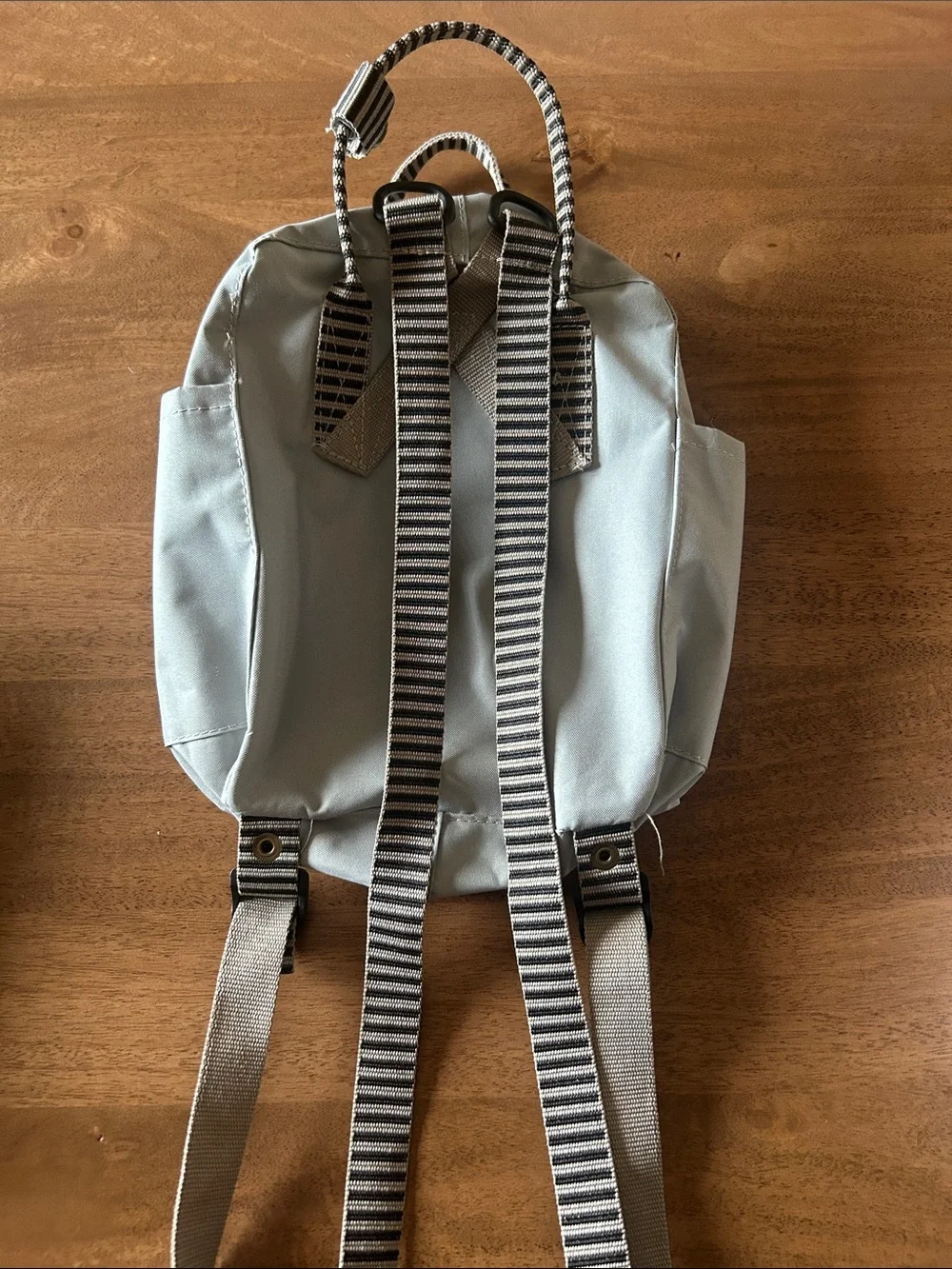 Fjallraven Kanken Mini Backpack in Light Gray with Red Logo